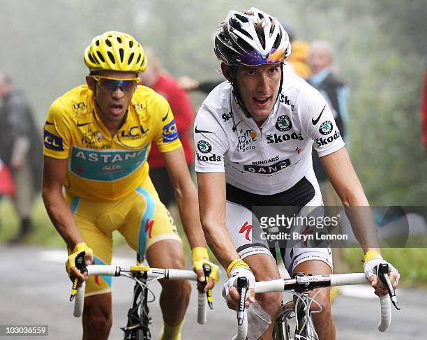 Andy Schleck of Luxembourg and Team Saxo Bank is followed by Alberto Contador of Spain and the Astana Team as he attacks up the slopes of the Col du...
