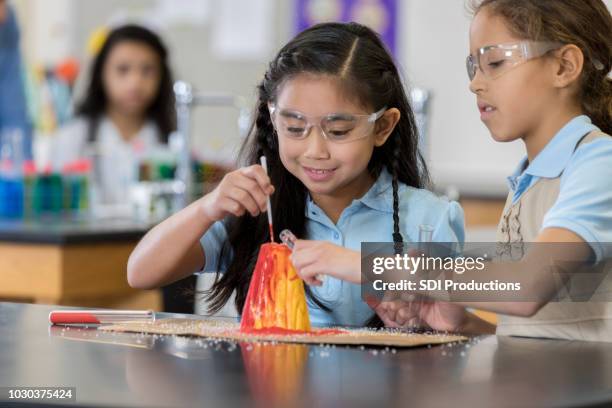 students create volcano during science class - volcano experiment stock pictures, royalty-free photos & images