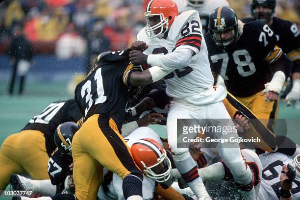 Tight end Ozzie Newsome of the Cleveland Browns blocks safety Donnie Shell of the Pittsburgh Steelers during a game at Three Rivers Stadium circa...