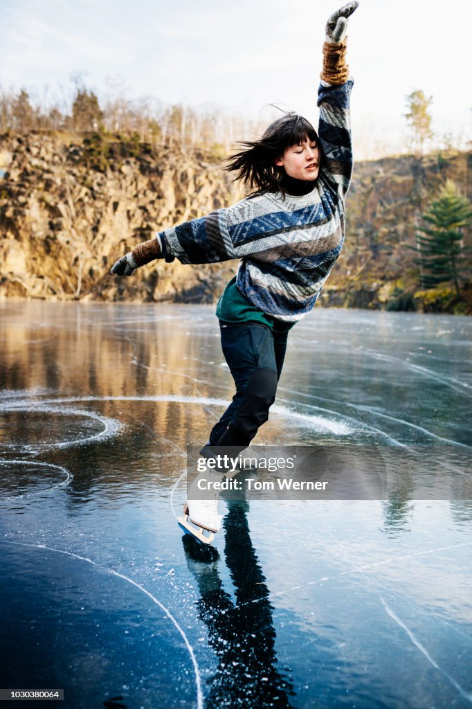 Talented Figure Skater Dancing On Frozen Lake