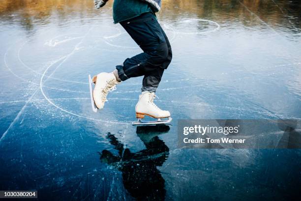 ice skater blades cutting curves into frozen lake - アイススケート ストックフォトと画像