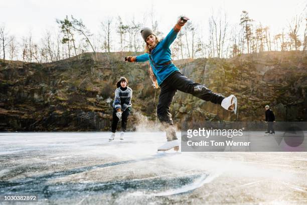 amateur figure skater posing on ice with friends - female exhibitionist fotografías e imágenes de stock