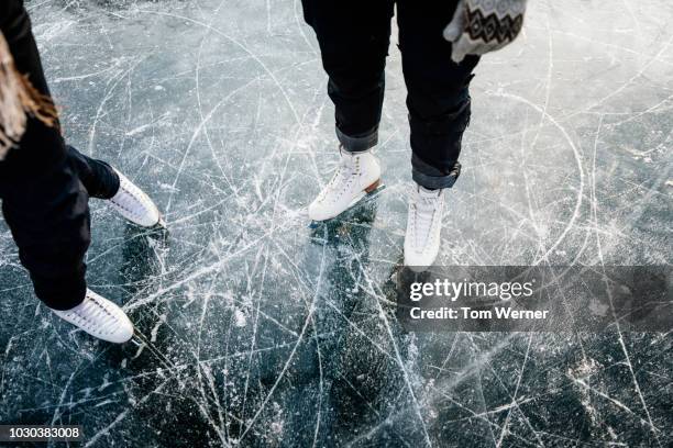 figure skater's ice skates from above - schaatsen stockfoto's en -beelden