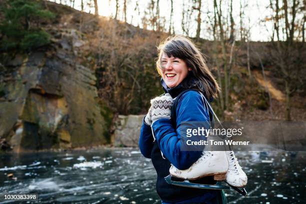portrait of amateur ice smater smiling - woman ice stock-fotos und bilder