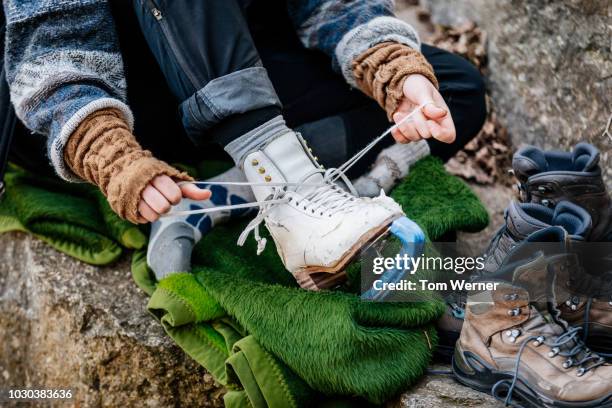 close up of figure skater tying laces - ice skate close up stock pictures, royalty-free photos & images