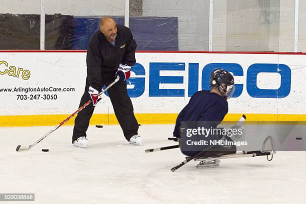 Grant Fuhr, five-time Stanley Cup Champion and Hockey Hall of Famer, at an on-ice clinic at the NHL And Verizon Team Up To Support Wounded Warriors...