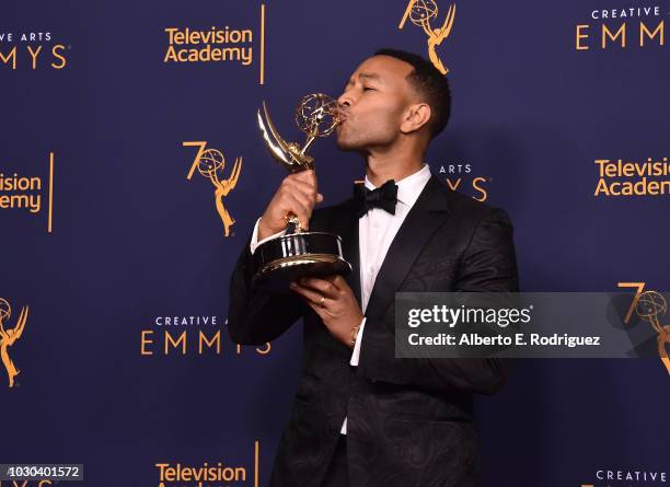 John Legend poses in the press room during the 2018 Creative Arts Emmys at Microsoft Theater on September 9, 2018 in Los Angeles, California.