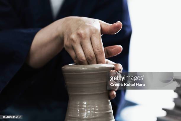 hands of woman enjoying pottery - pottery wheel stock pictures, royalty-free photos & images