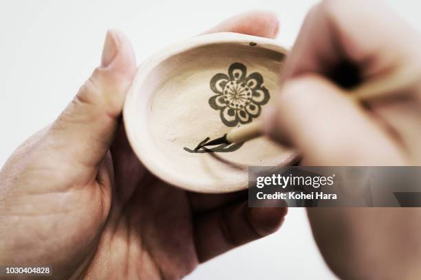 woman painting pottery - traditional craftsman stock pictures, royalty-free photos & images