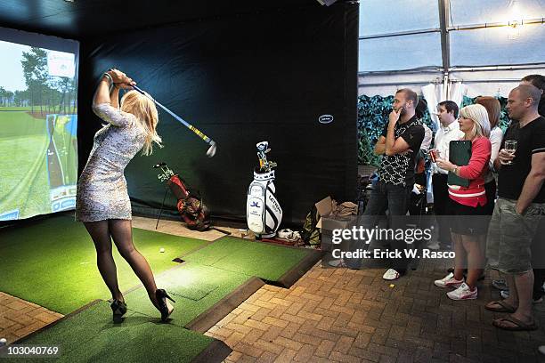 View of GolfPunk magazine columnist Sophie Horn playing virtual golf simulator at The Rule Pub. St. Andrews, Scotland 7/16/2010 CREDIT: Erick W. Rasco