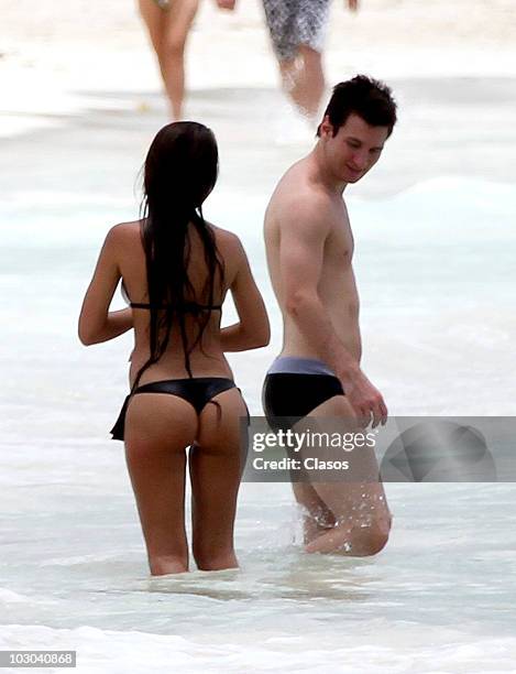 Argentine footballer Lionel Messi and girlfriend Antonella Rocuzzo are seen on July 20, 2010 in Cancun, Mexico.