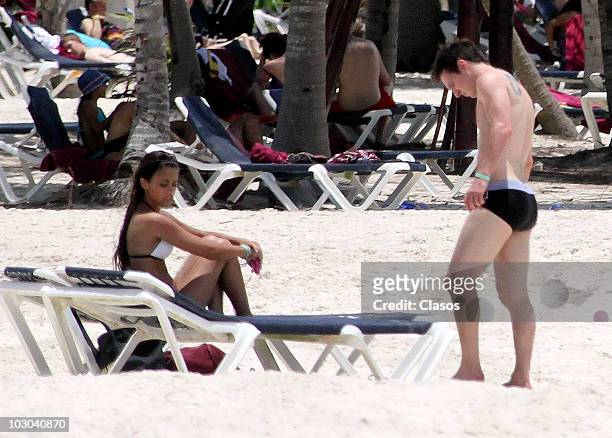 Argentine footballer Lionel Messi and girlfriend Antonella Rocuzzo are seen on July 20, 2010 in Cancun, Mexico.