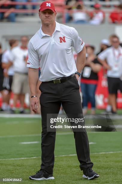 Head coach Scott Frost of the Nebraska Cornhuskers watches pregame warmups before the game against the Akron Zips at Memorial Stadium on September 1,...
