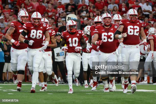 The offense for the Nebraska Cornhuskers takes the field before the first play of the game against the Akron Zips at Memorial Stadium on September 1,...