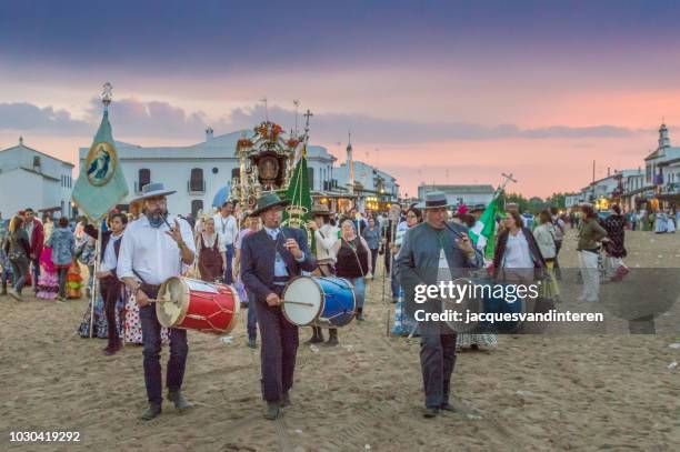 group of pilgrims arriving in el rocio, spain, during the romeria del rocio. - el rocio stock pictures, royalty-free photos & images