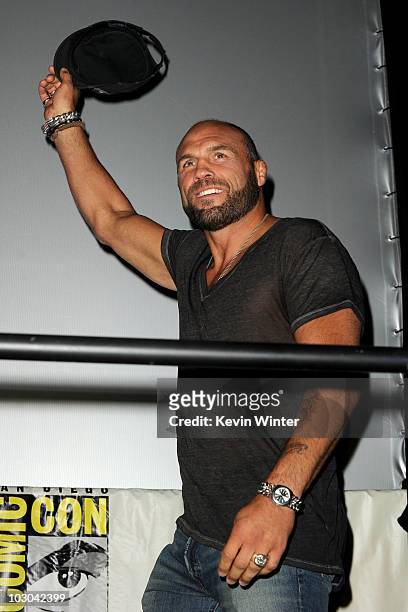 Ultimate Fighter/actor Randy Couture walks onstage at the "The Expendables" panel during Comic-Con 2010 at San Diego Convention Center on July 22,...