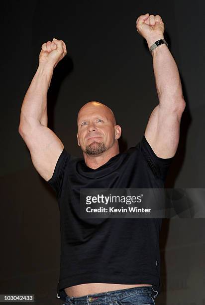 Actor Steve Austin walks onstage at the "The Expendables" panel during Comic-Con 2010 at San Diego Convention Center on July 22, 2010 in San Diego,...