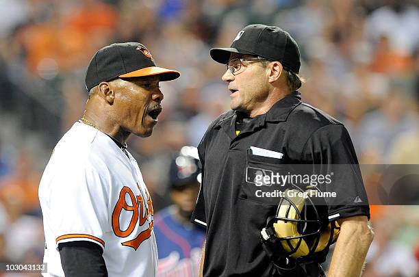 Interim Manager Juan Samuel of the Baltimore Orioles argues with home plate umpire Bill Hohn during the seventh inning of the game against the...