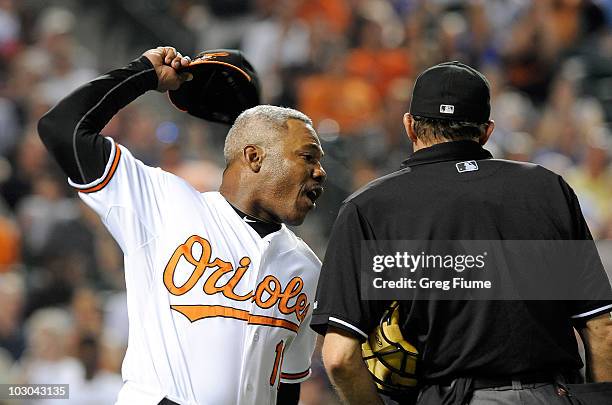 Interim Manager Juan Samuel of the Baltimore Orioles throws his hat after being ejected from the game by home plate umpire Bill Hohn during the...