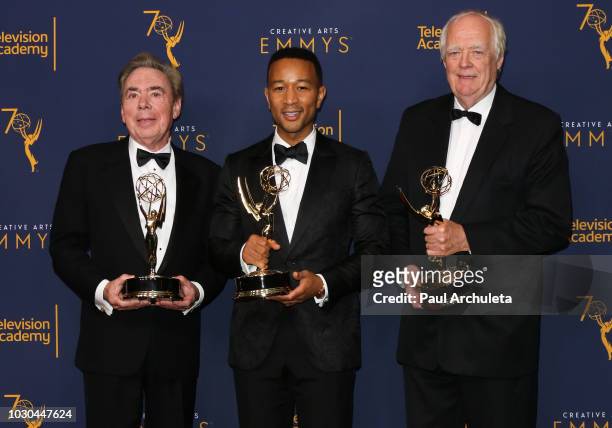 Andrew Lloyd Webber, John Legend, and Tim Rice pose in the press room of the 2018 Creative Arts Emmy Awards - Day 2 at Microsoft Theater on September...