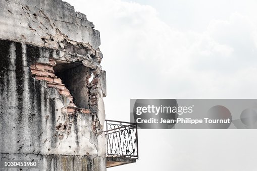 Scars from the Bosnian War - Rocket hole in an abandonned house near Mostar, Bosnia and Herzegovina Scars from the Bosnian War - Rocket hole in an abandonned house near Mostar, Bosnia and Herzegovina
