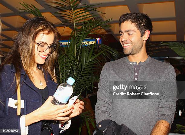 American actor and filmmaker Adrian Grenier talks with Australian actress Isabel Lucas at the presentation of his film "Teenage Paparazzo" at the...