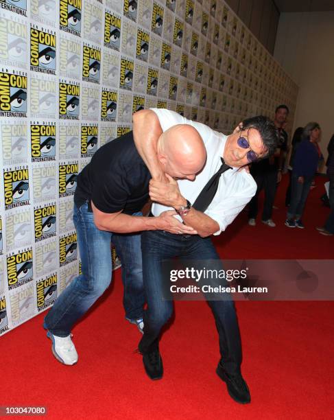 Actors Steve Austin and Sylvester Stallone arrive at "The Expendables" panel on day 1 of Comic-Con International at San Diego Convention Center on...