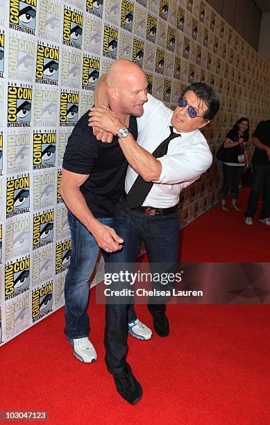 Actors Steve Austin and Sylvester Stallone arrive at "The Expendables" panel on day 1 of Comic-Con International at San Diego Convention Center on...