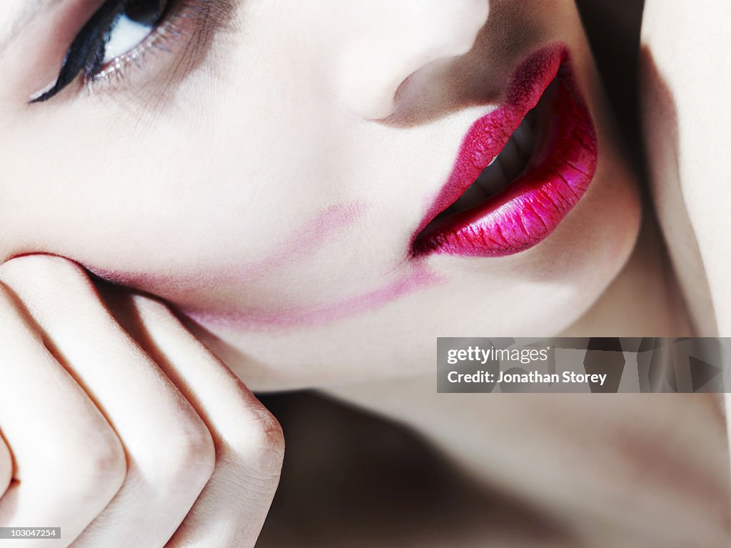 Beauty smudged  pink lip stick.