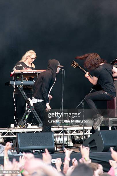 Alice Spooner, James Smith and Daniel 'Pilau' Rice of Hadouken perform on the main stage during day one of Guilfest at Stoke Park on July 16, 2010 in...