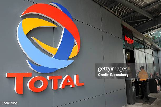 Total SA logo is seen at a gas station in Paris, France, on Thursday, July 22, 2010. The company, Europe's biggest oil refiner, releases its earnings...