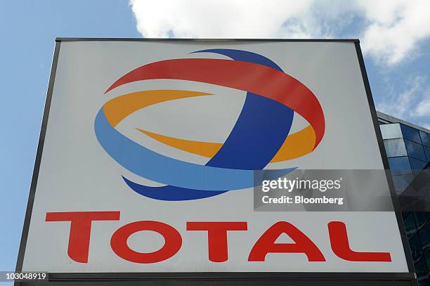Total SA logo is seen at a gas station in Paris, France, on Thursday, July 22, 2010. The company, Europe's biggest oil refiner, releases its earnings...
