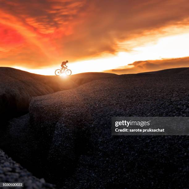 mountain bike cyclist cycling on the hill mountain twilight time on top of a mountain , extreme sport concept. - bike wheel race stock pictures, royalty-free photos & images