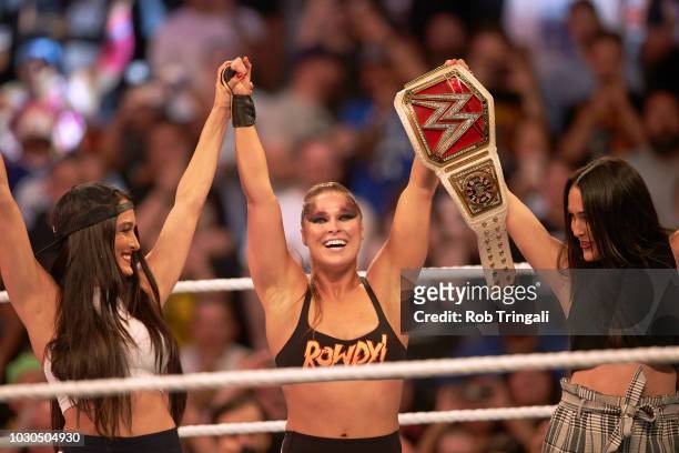 Professional Wrestling: WWE SummerSlam: Ronda Rousey victorious in ring with while holding belt after winning Raw Women's Championship match vs Alexa...