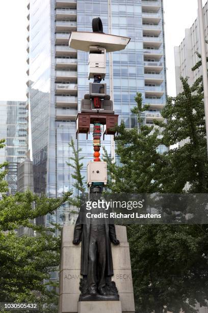Life's Little Worries of Sir Adam Beck is an art piece by Tatsu Nishi, a Japanese artist, at Queen & University. It is a bunch of things stacked on...