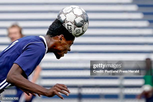 Portland's Gracien Mukwa heads the ball back upfield during a boys soccer match vs. Gorham at Fitzpatrick Stadium in Portland, Saturday, September 8,...