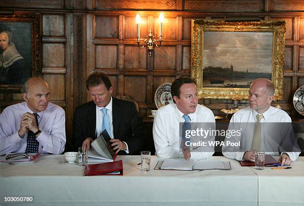 Business Secretary Vince Cable, Cabinet Secretary Gus O'Donnell, Prime Minister David Cameron and Foreign Secretary William Hague at Chequers, the...