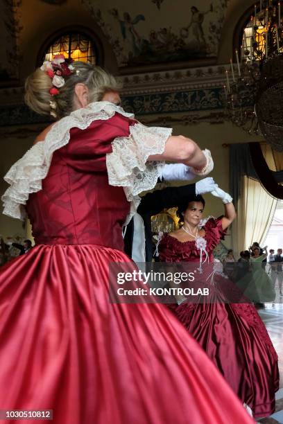 Dancers perform on valzer and dances of the nineteenth century during the historic ball that was held in the hall of dances at the Royal palace of...
