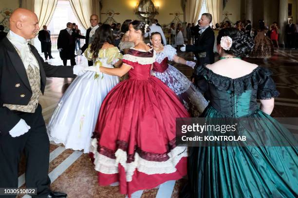Dancers perform on valzer and dances of the nineteenth century during the historic ball that was held in the hall of dances at the Royal palace of...