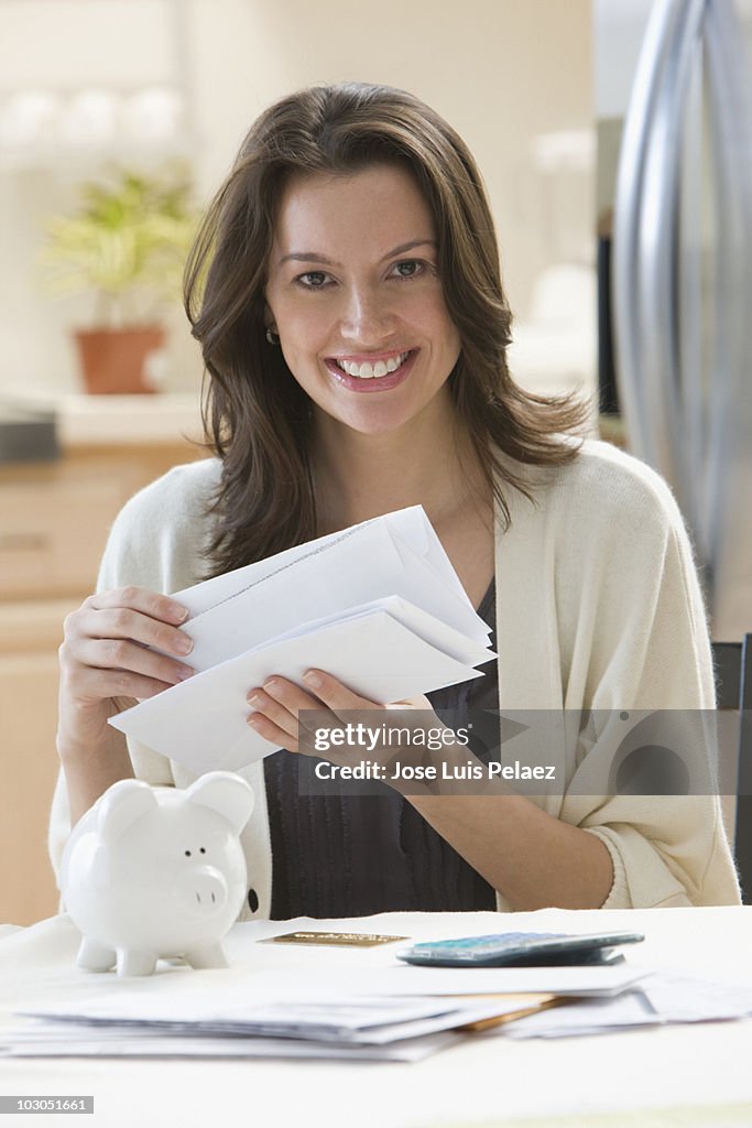 Young woman reading the mail