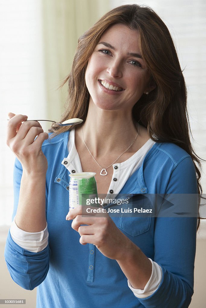 Woman eating yogurt