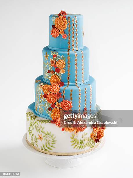 tiered blue and orange wedding cake - cake tier stock pictures, royalty-free photos & images