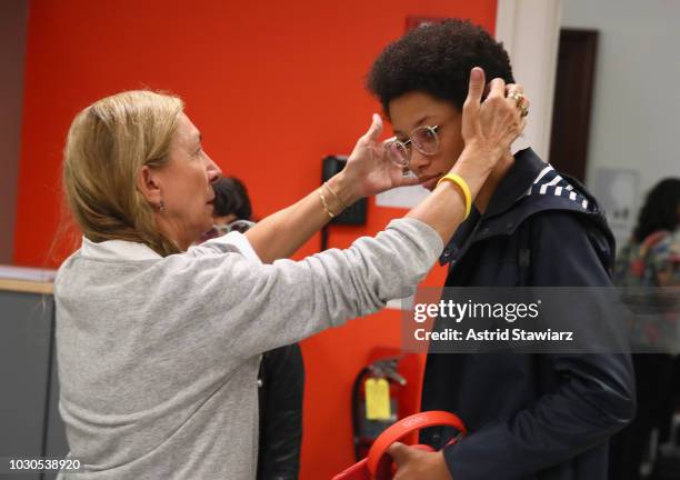 Hairstylist Odile Gilbert prepares models backstage for TRESemme At Carolina Herrera during New York Fashion Week on September 10, 2018 in New York...