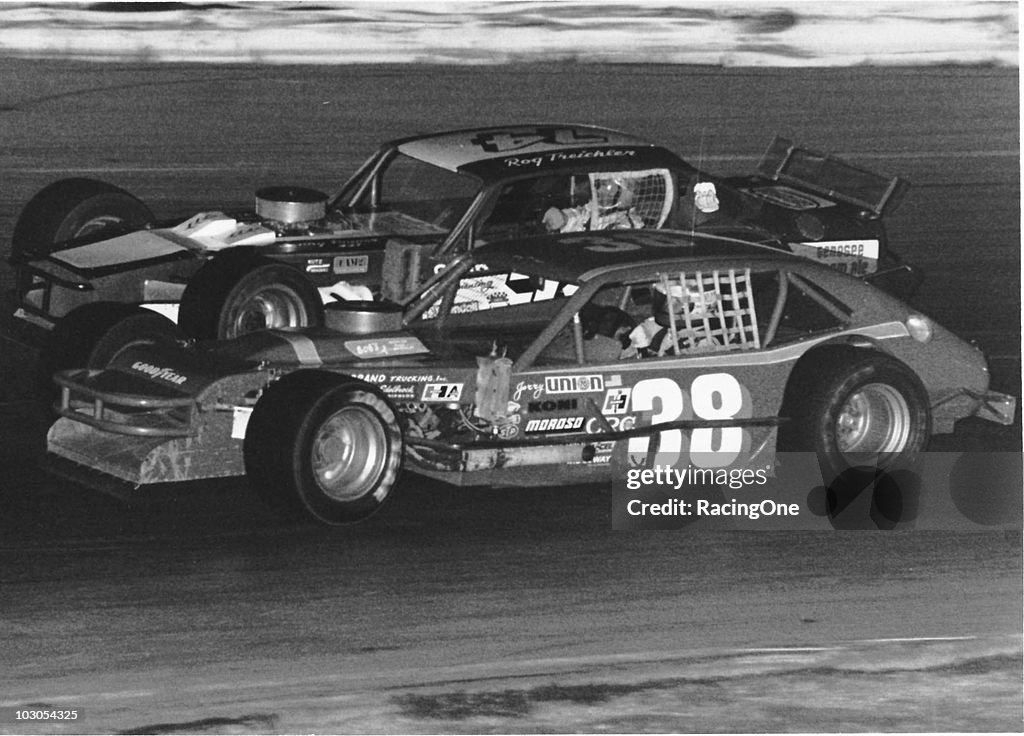Jerry Cook races with Roger Treichler during a NASCAR Modified race ...