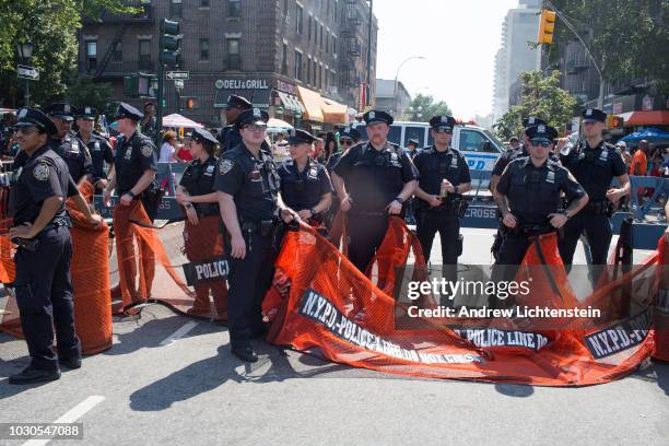 Police watch over the annual West Indian Day Parade on September 3, 2018 in Brooklyn, New York.