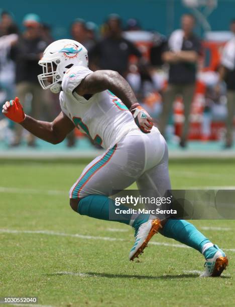 Linebacker Raekwon McMillan of the Miami Dolphins runs against the Tennessee Titans at Hard Rock Stadium on September 9, 2018 in Miami, Florida. The...