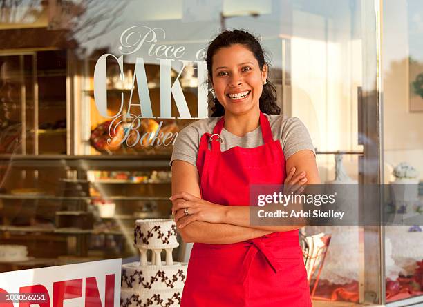 hispanic woman business owner outside shop - bakery apron bildbanksfoton och bilder