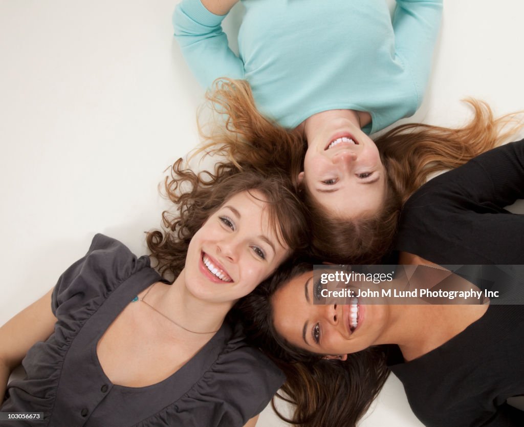 Friends laying on floor together