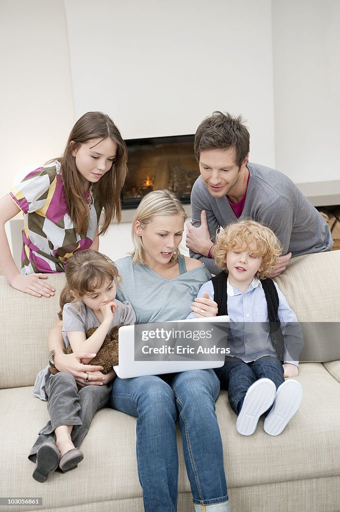 Family using a laptop