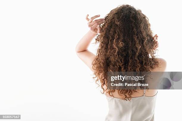 rear view of a woman - curly hair stock pictures, royalty-free photos & images